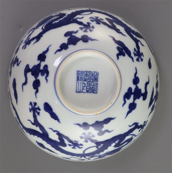 A Chinese blue and white dragon bowl, Qianlong seal mark and period (1736-95), D. 14.7cm, faults